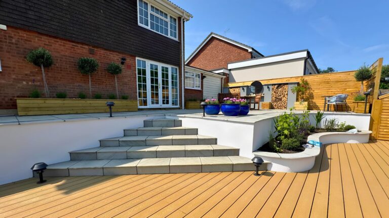 Hitchin contemporary multi-level garden, Hertfordshire — water feature wall and decking