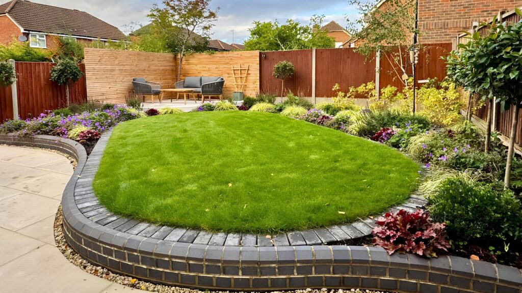 Finished curved garden with Indian sandstone patio